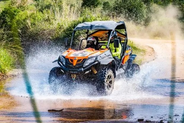 Buggy driving through water on an off-road tour near Almancil in the Algarve